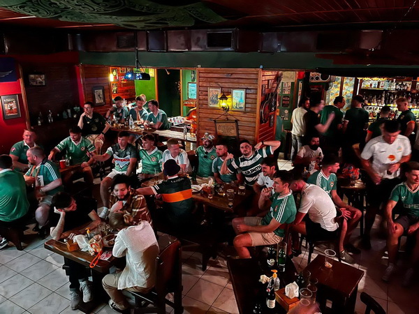 A crowd of supporters filling the pub on match day